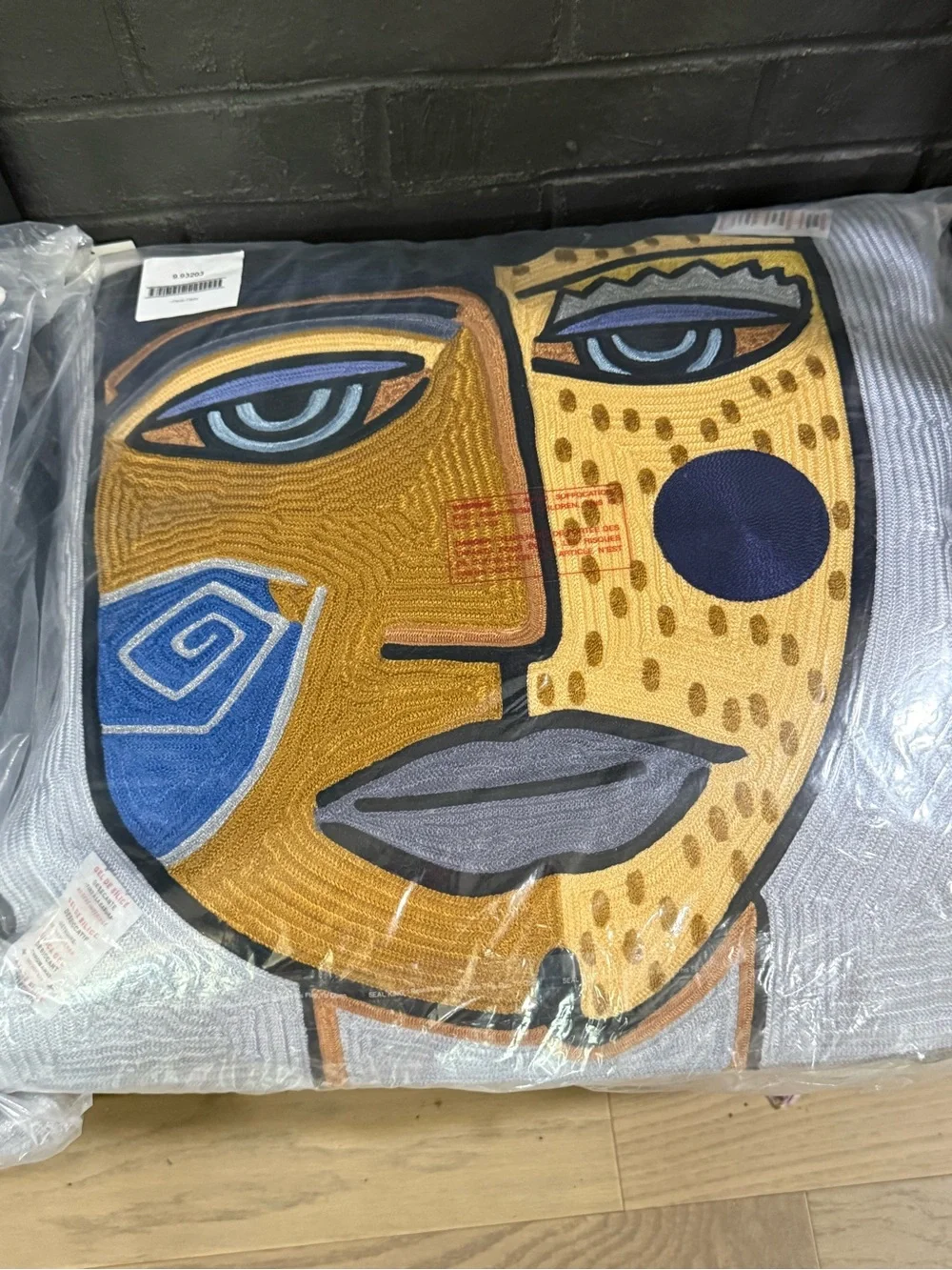 Global Views Abstract Face Accent Pillow in Yellow, Blue, Black, Gray